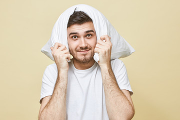 People, lifestyle, rest, health and recreation concept. Handsome unshaven young guy in white...