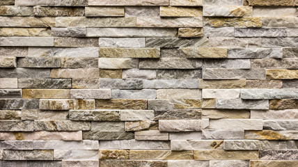 wall background made of small marble tiles laid horizontally