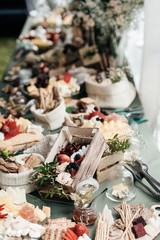 Obraz na płótnie Canvas Festive table with food. Wood decor