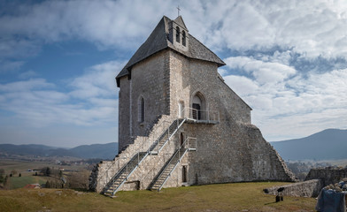 Ruins of the castle Sokolac with the chapel of Holy trinity on the hill in village Brinje, Lika,...