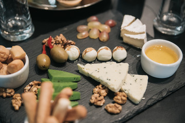 Festive table with food. Cheese and nuts
