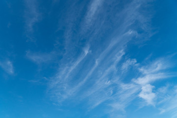 Bright, blue sky with a few small clouds