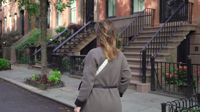 Young girl walking in a New York city midtown, soho district