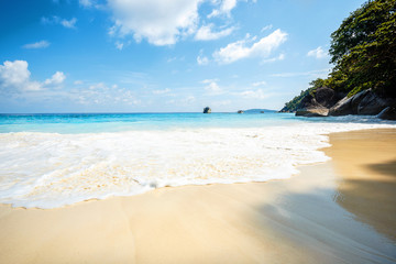 Sea view from tropical beach with sunny sky