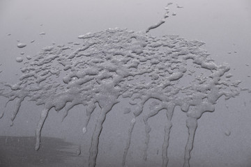 close up a piece of melted ice on a car