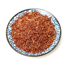 Red rice on white background 