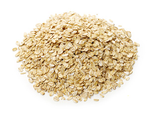 Oat flakes pile on white background 