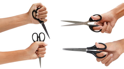 Hand holding scissors isolated on white background - clipping paths.