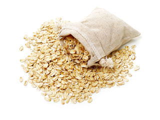 Oat flakes pile on white background 