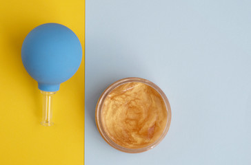 vacuum can to massage the face and oil.  minimalist creative concept.