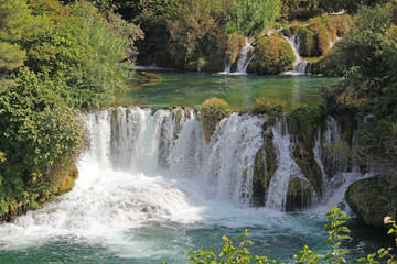 Krka National Park with a beautiful Skradinski Buk waterfall in early autumn, famous travel destination in Dalmatia of Croatia. Europe.