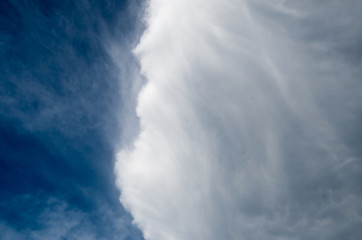 Cloud front pushing into blue skies creating an interesting pattern