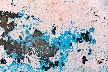 Texture of a concrete wall with cracks and scratches which can be used as a background