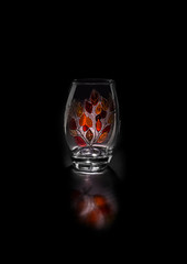 Hand painted glass vase. The background is black. Isolated.