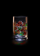 Hand painted glass vase. The background is black. Isolated.