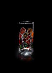 Hand painted glass vase. The background is black. Isolated.