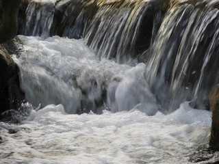 waterfall on river on winter season