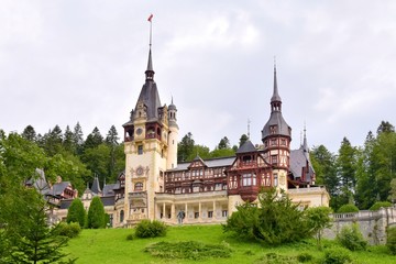 Fototapeta premium Sinaia, Romania - August 2019. Great Pelesh castle and park in Sinaia, Romania. Romania King Carol Palace and park with medieval beautiful buildings 