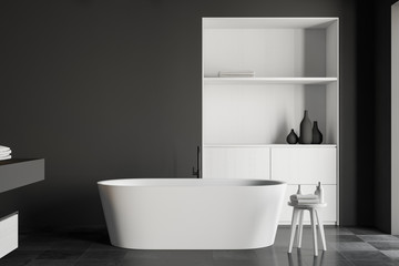 Fototapeta na wymiar Gray bathroom interior with tub and cabinet