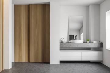 White and wooden bathroom interior with sink