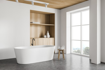 Fototapeta na wymiar White bathroom corner with tub and cabinet