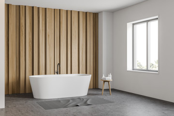 White and wooden bathroom corner with tub
