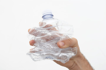 hand with plastic bottle of water isolated on white