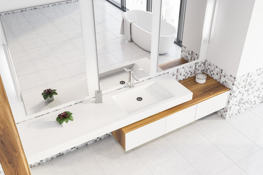 Top view of white and mosaic bathroom interior