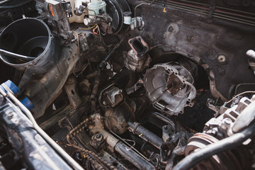 Closeup of the engine compartment of the car with the engine removed for overhaul, transportation and insurance industry concepts.