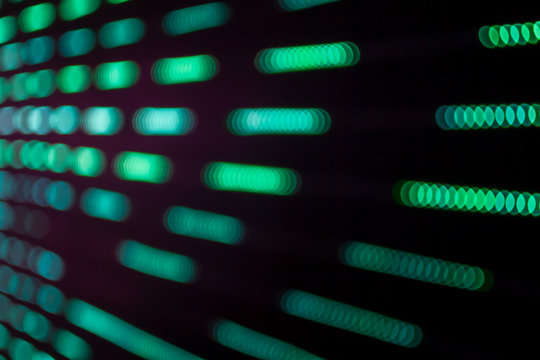 Abstract beautiful blurred or softy bokeh from LED lighting. Group of blurry brightness blue ornamental lights flickering in the park. Image for digital data transformation or Sci-Fi mystery concept.