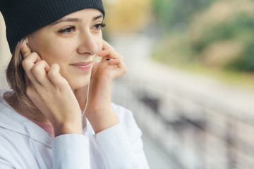 girl listening to music on the street