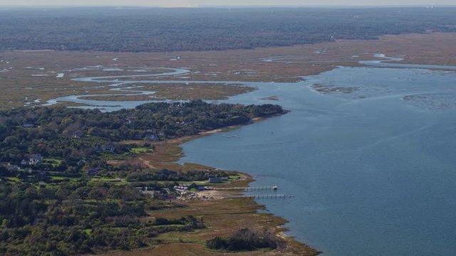 Cape Cod Massachusetts Aerial v8 Ascending panoramic view of the Great Marshes with neighborhood and Bay views - October 2017