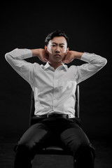 LWTWL0007391 young asian businessman on black background