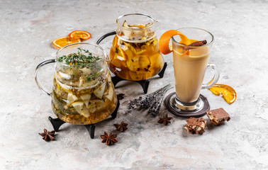 Set of various winter cocktails: mulled wine, eggnog, limoncello, old-fashioned, coconut margarita. White linen background.