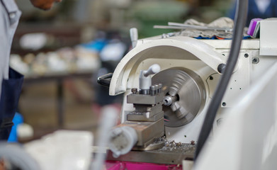  People are working with turning machines. 