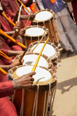 Fototapeta na wymiar Close up of Group of People hands performing Indian art form Chenda or chande a cylindrical percussion playing during festival.