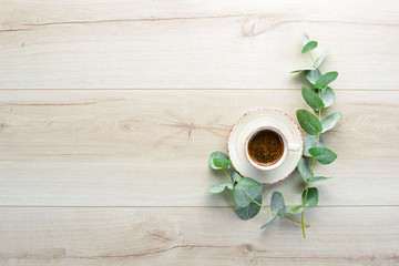 Cup of coffee on the table. Top view. Free space for your text.
