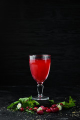 Fresh Morse of Cranberry Berries In a glass. Top view. On a black background.