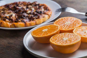Naklejka na ściany i meble LWTWL0007625 Delicious italian pizzas served on wooden table wiht orange