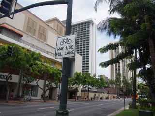 Bicycle signs in the city that say "MAY USE FULL LANE", Honolulu, Hawaii, USA