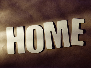 The word Home on paper background