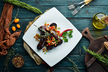Sausage with buckwheat and blood. Restaurant dishes. Top view. Free copy space.