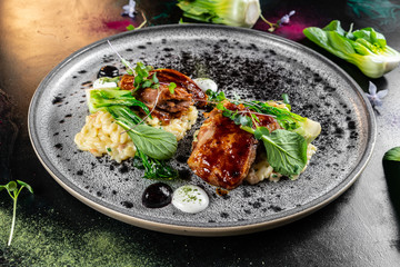Grilled chicken breast. Fried chicken fillet and fresh vegetable salad of tomatoes, cucumbers and arugula leaves. Chicken meat with salad. Healthy food. Flat lay. Top view. Dark background
