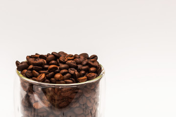 Coffee beans in cup and all around. Background. Texture