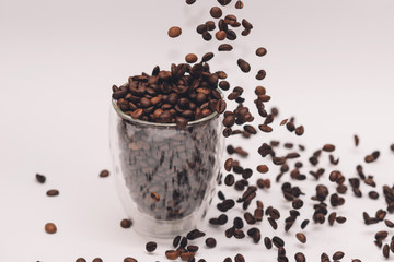 Coffee beans in cup and all around. Background. Texture