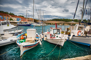 Fototapeta premium Beautiful landscape with bay and colorful buildings on the background in the town of Asos , Greece, Kefalonia. Wonderful exciting places. Panorama. Amazing Greece - picturesque colorful village