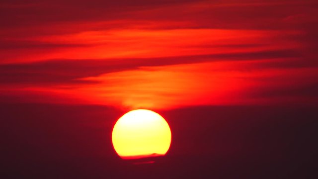 4K Big sun sunset sky orange sky orange  outdoor summer nature sunrise with silver lining and cloud on the orange sky