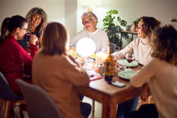 Beautiful group of women smiling happy and confident. Eating roasted turkey celebrating christmas at home