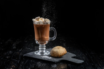 Chocolate dessert, hot chocolate with slices of ice cream, two livers lie nearby.