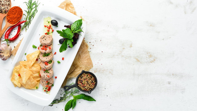 Goose liver pate on a plate. Fuagra. Restaurant dishes. Top view. Free space for your text.